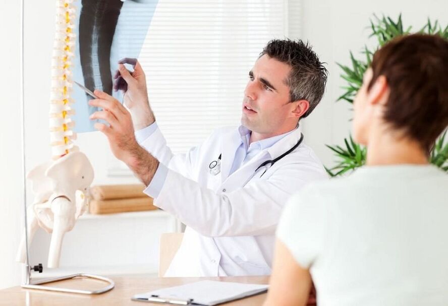 the doctor examines an X-ray to diagnose osteochondrosis of the chest